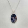 Pendentif en sodalite et fil de cuivre argenté