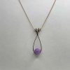 Pendentif en kunzite mauve et fil de cuivre bronze