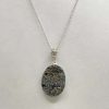 Pendentif en pyrite sur roche mère